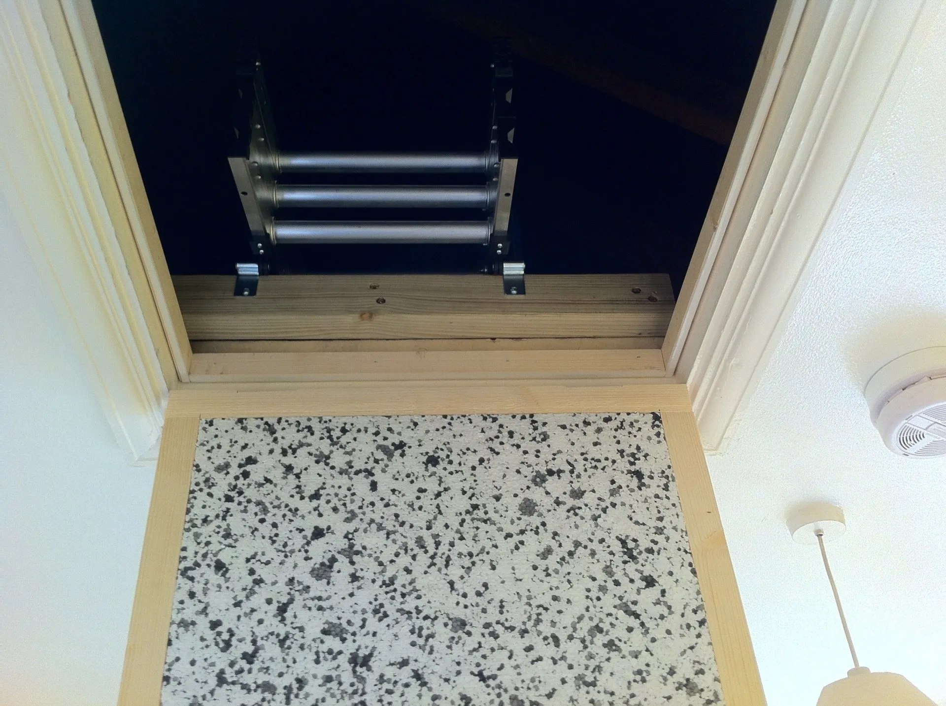 Close-up of dual computer monitors with green coding interfaces in a dark room, highlighting cyber security themes.