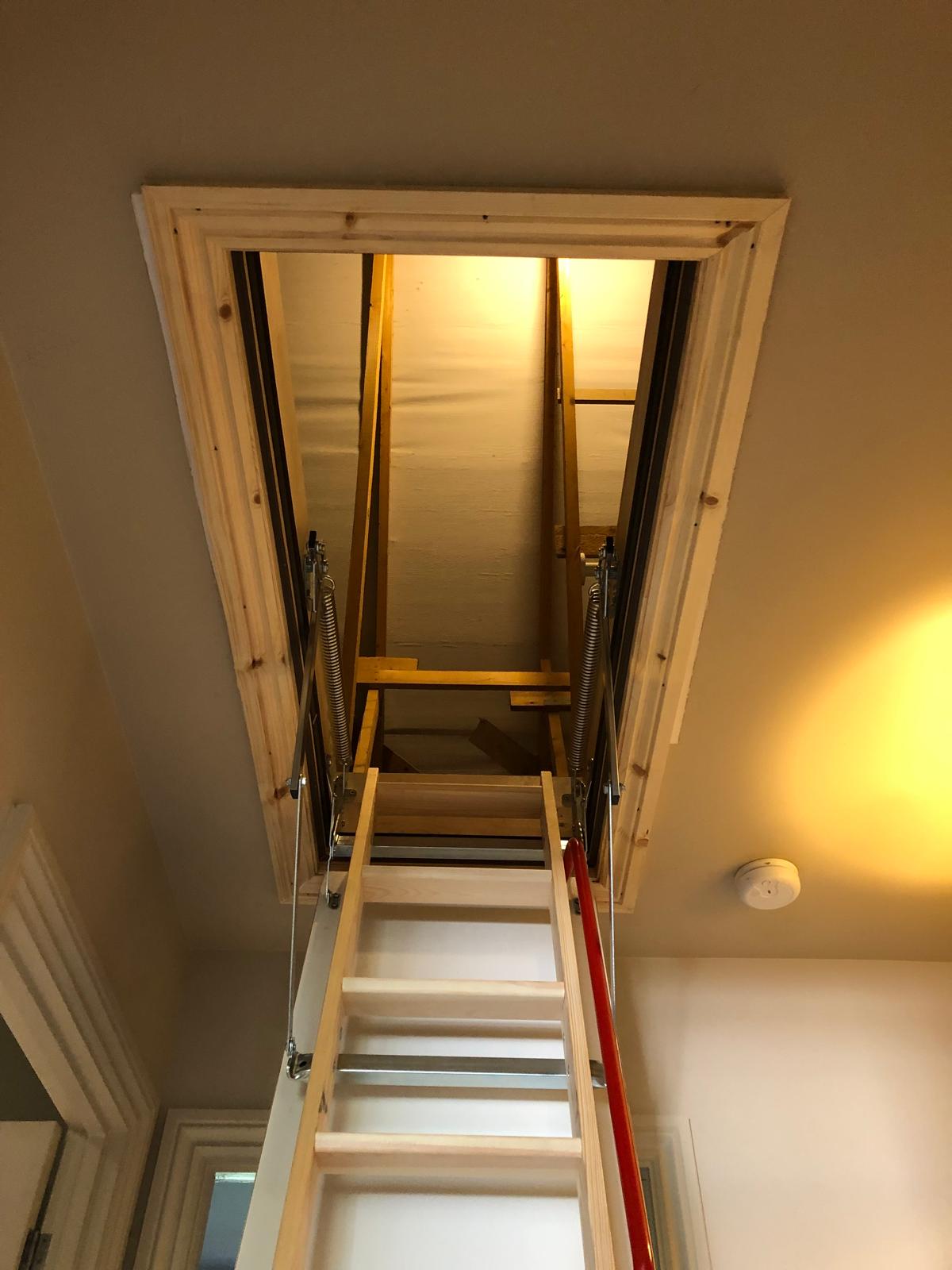 brown wooden dining table with two gray seats near opened window