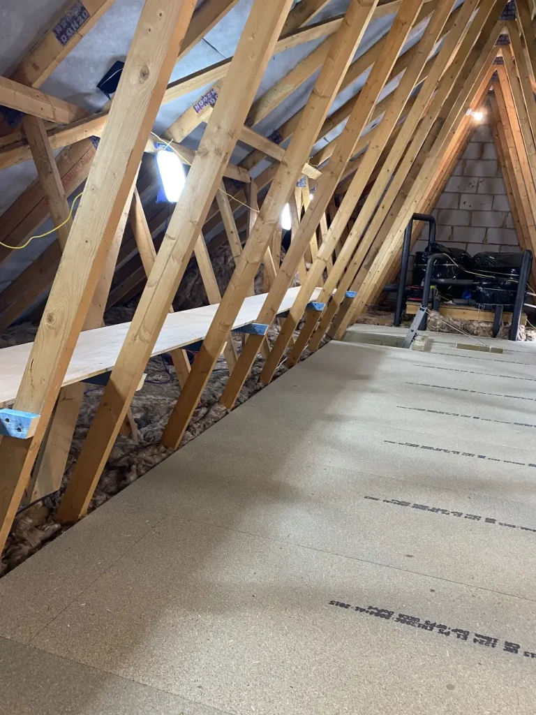 a pile of wood sitting on top of a wooden floor